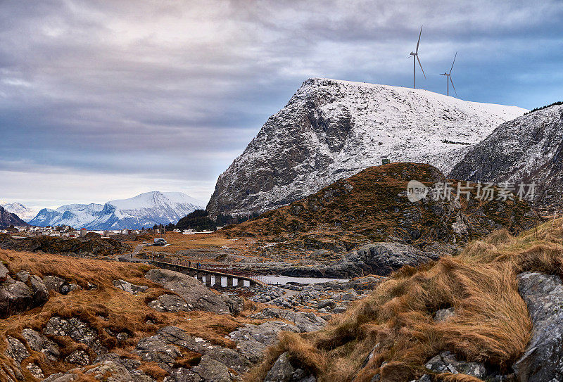 The turbines of a wind farm are seen from the top of Møre og Romsdal in Alesund, Halamseya, Norway.